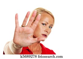 Woman holding hands in front of her face.