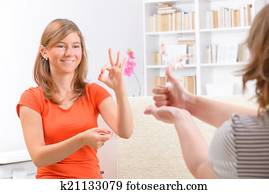 Deaf woman learning sign language Deaf woman learning sign language