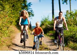 Family riding bicycles for sport Family riding bicycles for sport