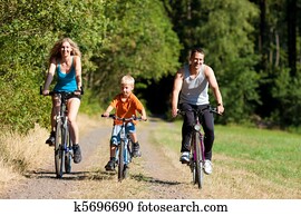 Family riding bicycles for sport Family riding bicycles for sport