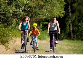 Family riding bicycles for sport Family riding bicycles for sport