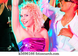 Friends dancing in club or disco