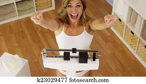 Happy woman celebrating weight loss Happy woman celebrating weight loss
