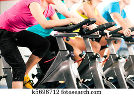 Indoor bycicle cycling in gym Indoor bycicle cycling in gym