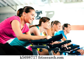 Indoor bycicle cycling in gym Indoor bycicle cycling in gym