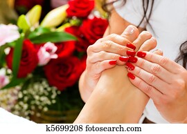 Woman in nail studio receiving foot massage