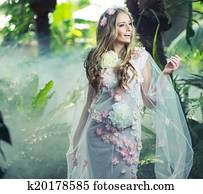 Glad blond woman with a wreath on the head