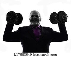 senior business man holding weights silhouette