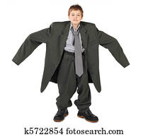 little boy in big grey man's suit and boots nads at sides isolated on white background