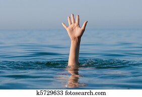 single hand of drowning man in sea asking for help