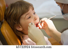 young girl have periodic survey tooth in medical office