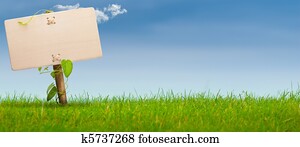 green sign, horizontal banner, blue sky