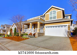 Happy yellow new house exterior photo during spring