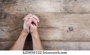 Bible and praying hands