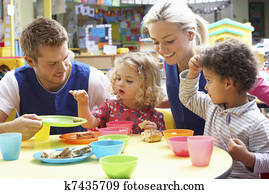 Couple and children playing with toys Couple and children playing with toys