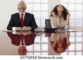 Frustrated colleagues playing at conference call