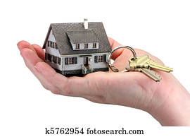 Hand holding house keys