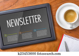 Tablet on a desk - Newsletter Tablet on a desk - Newsletter