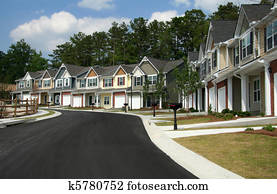 A row of new townhomes or condominiums A row of new townhomes or condominiums