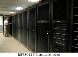 Technician working on racks of server Technician working on racks of server