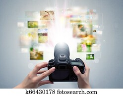 Hand captures life events with digital camera