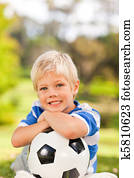 Boy with his ball in the park Boy with his ball in the park