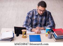 Young male student sitting in the classroom Young male student sitting in the classroom