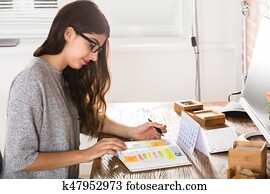 Businesswoman Writing Schedule In Diary Businesswoman Writing Schedule In Diary
