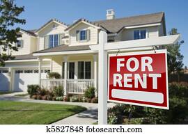 For Rent Real Estate Sign in Front of House
