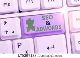 Writing note showing Seo And Adwords. Business photo showcasing Pay per click Digital marketing Google Adsense. Writing note showing Seo And Adwords. Business photo showcasing Pay per click Digital marketing Google Adsense.