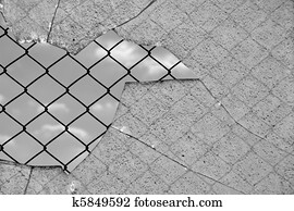 broken glass and wired fence