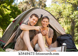 Couple camping in the park Couple camping in the park