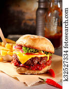 Cheeseburger with hot spicy chili sauce