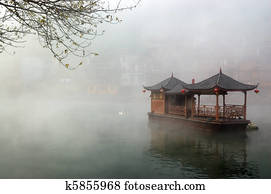 China landscape of boat on foggy river