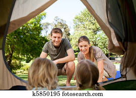 Happy family camping in the park Happy family camping in the park
