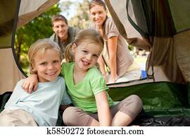 Happy family camping in the park Happy family camping in the park