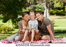 Joyful family picnicking in the park Joyful family picnicking in the park