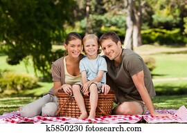 Joyful family picnicking in the park Joyful family picnicking in the park