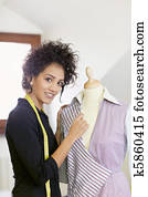 Woman working in fashion design studio