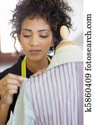 Woman working in fashion design studio