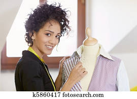 Woman working in fashion design studio