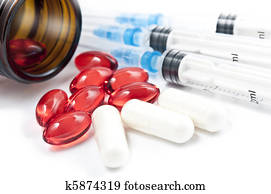 Pills with syringes isolated Pills with syringes isolated