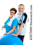 senior couple in gym