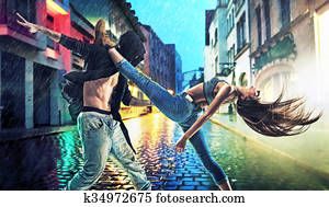 Persevering young dancers practising in rain