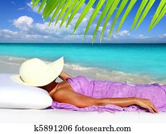 Caribbean tourist resting beach hat woman