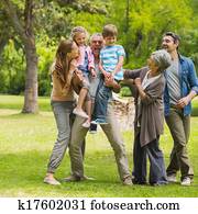 Extended family playing in park