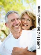 Mature couple smiling and embracing