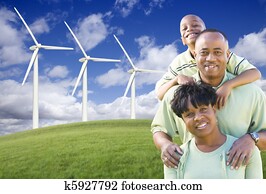 Happy African American Family and Wind Turbine