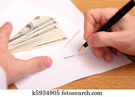 Businessman signing a contract and getting money for it Businessman signing a contract and getting money for it