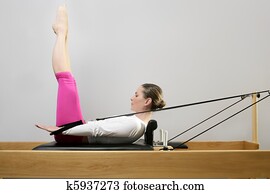 gym woman pilates stretching sport in reformer bed gym woman pilates stretching sport in reformer bed